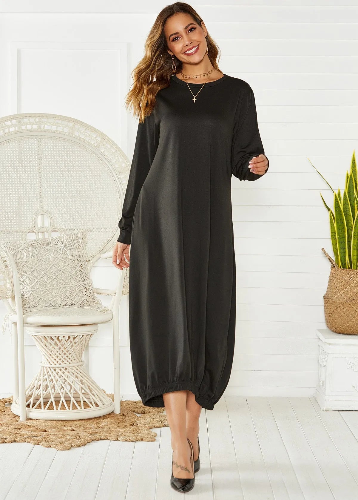 Women's black lantern dress with lace-up crew neck, loose casual silhouette, knitted polyester fabric.