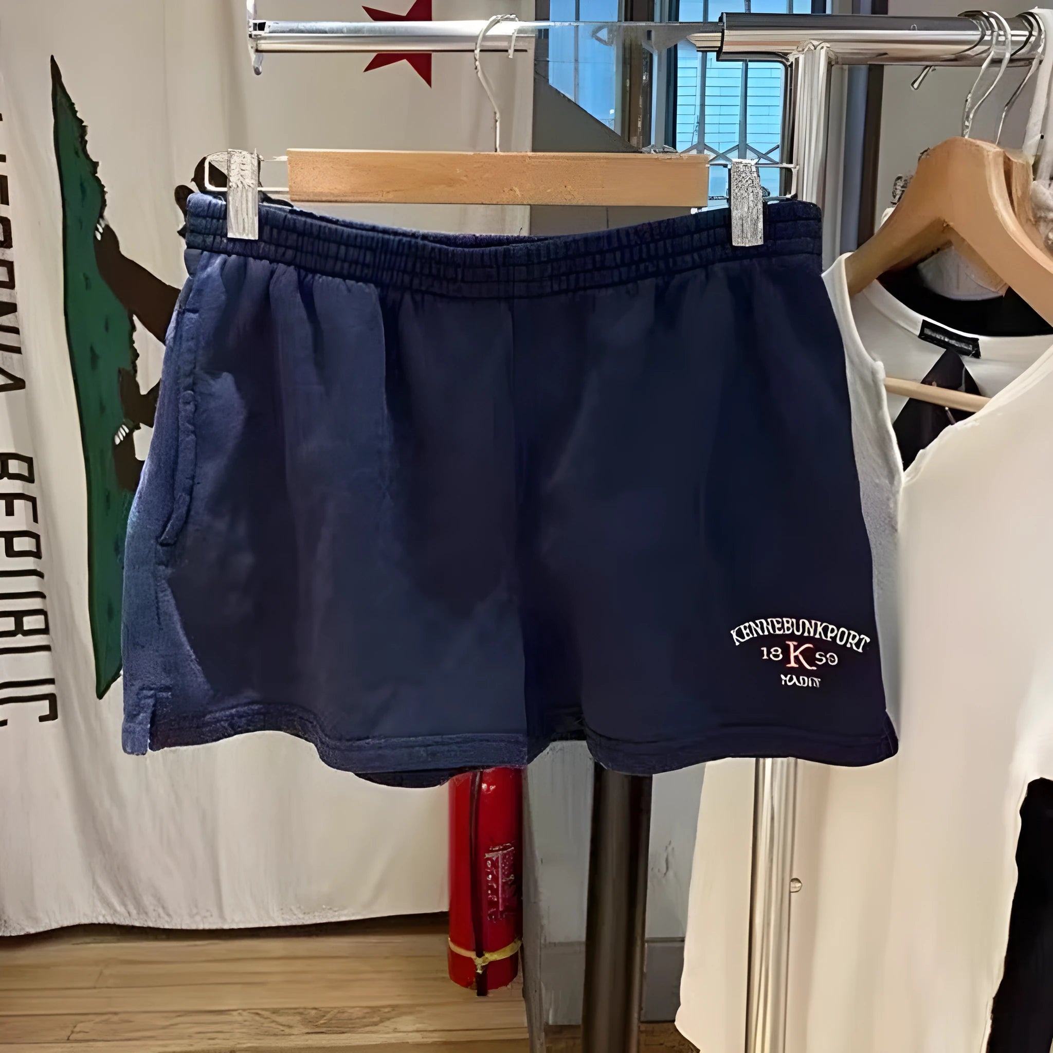Women's dark blue cotton sports shorts with white flag embroidery detail