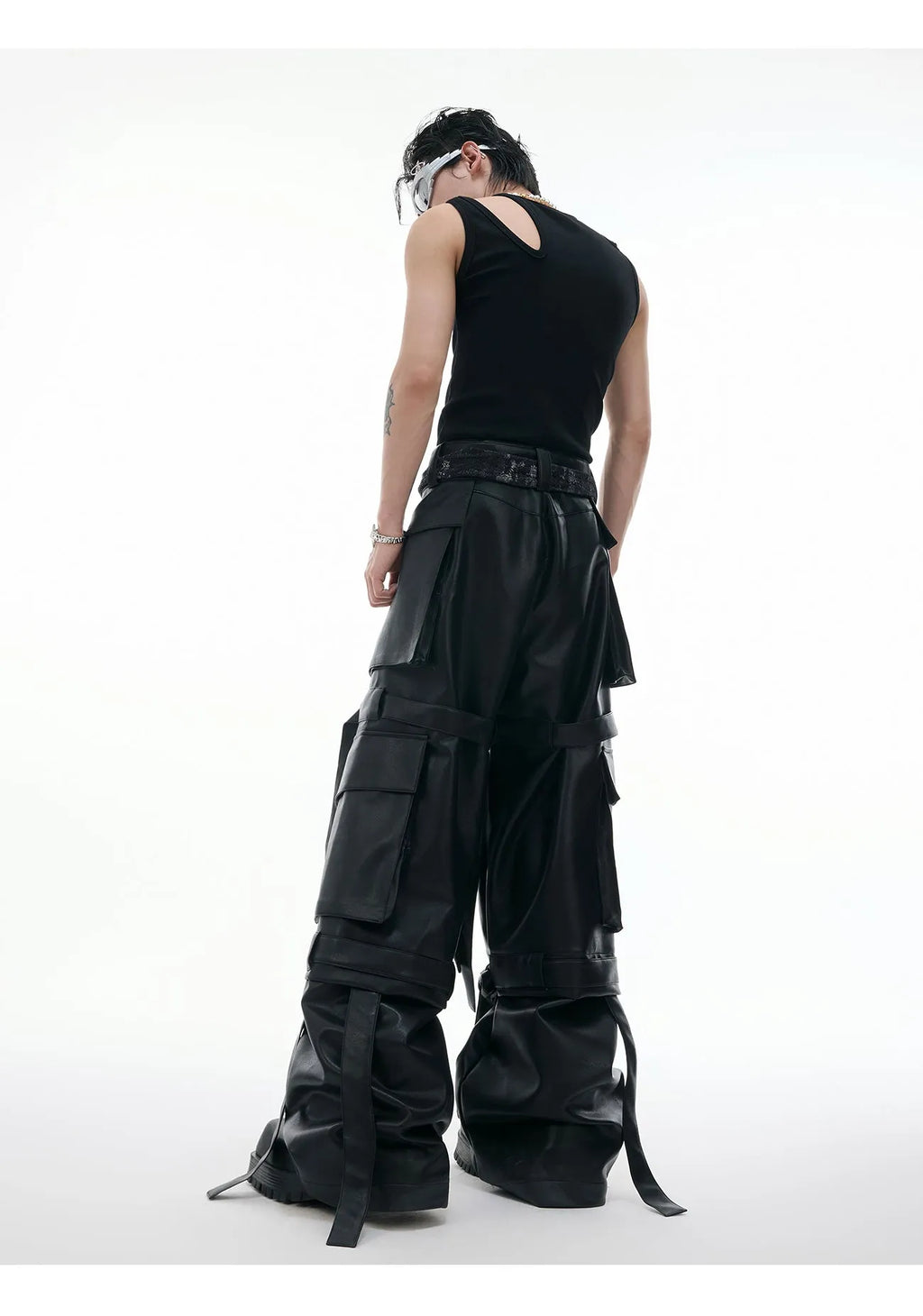 Black loose-fit quilted trousers with multiple pockets and retro stitching detail.