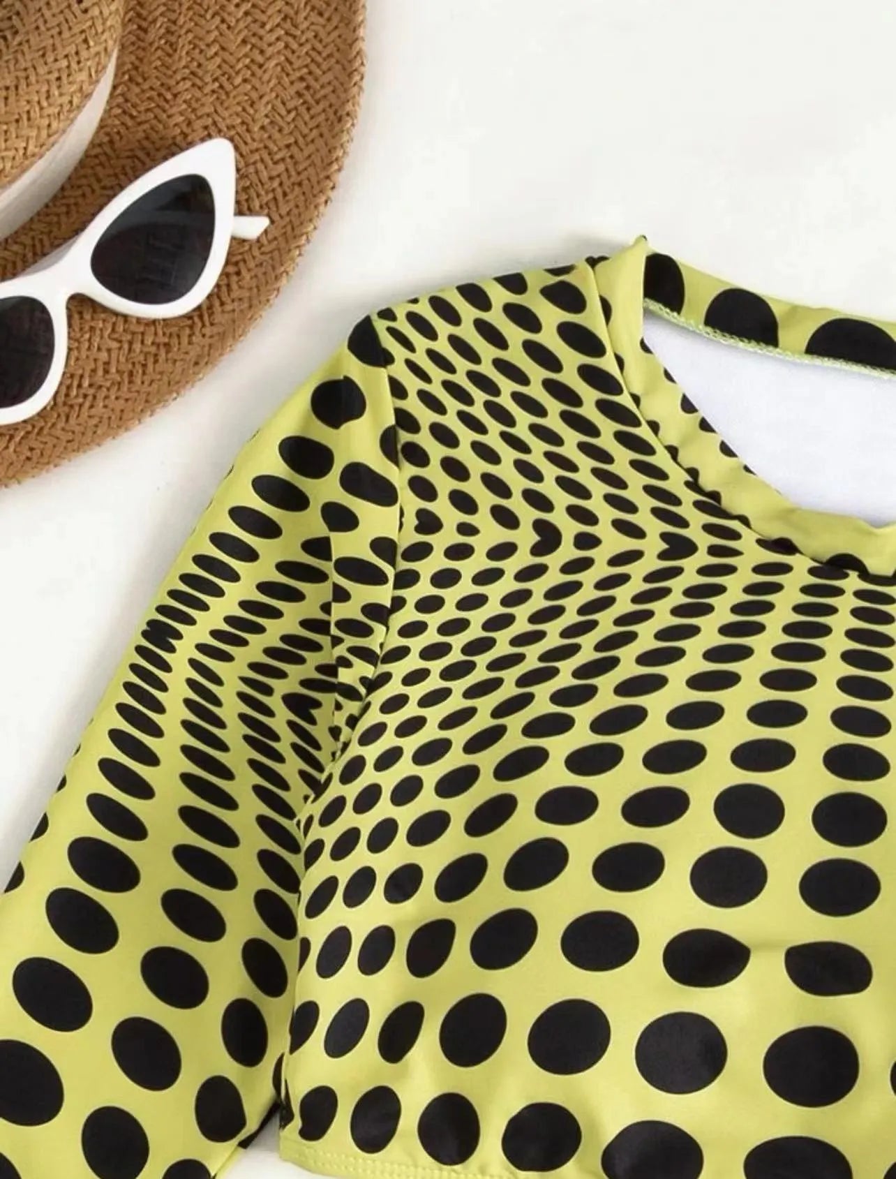 Green and yellow polka dot women's swimsuit three-piece set showing top, skirt, and bra