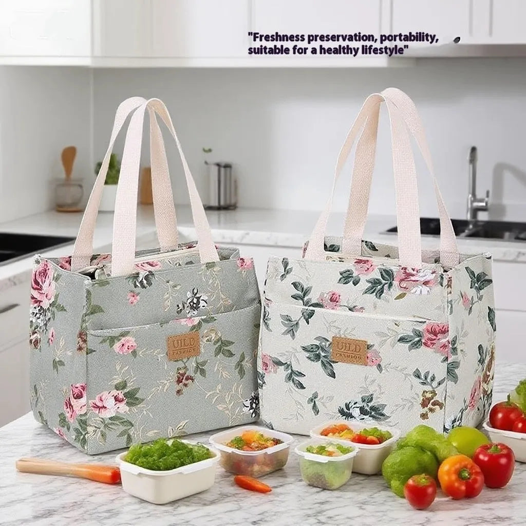 Women's square canvas handbag with floral and animal prints, showing aluminium hardware.