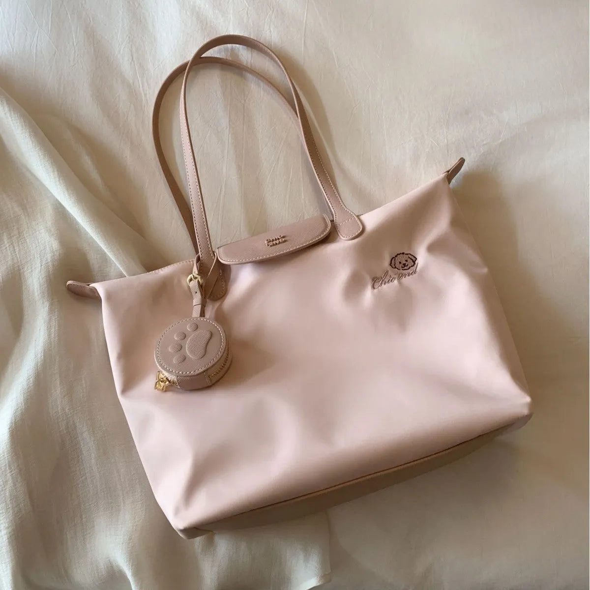 Large capacity Oxford cloth tote bag with sandwich pocket design and mobile phone compartment in pink colour