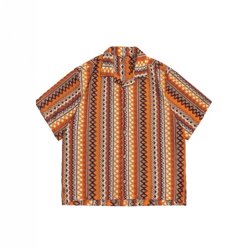 Man wearing a loose-fit ethnic style woven shirt with a Cuban collar and contrast colours.