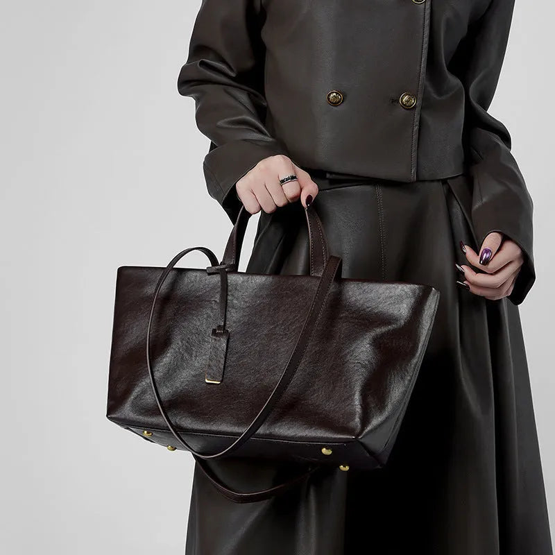 Genuine leather women's underarm shoulder bag in brown, 32x13x22cm, with sewing line detail