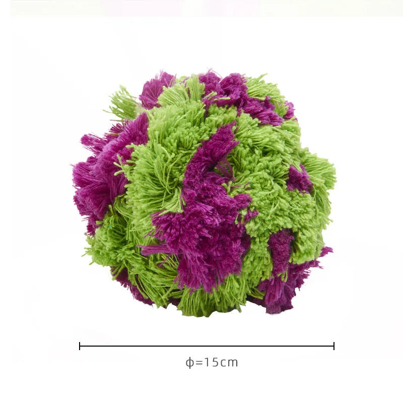 Purple plush dog sea ball chew toy with white knot designs, approximately 15cm diameter