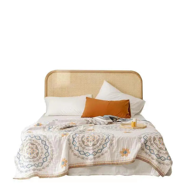 Cotton geometric pattern towel blanket laid flat, showing its modern design and size.