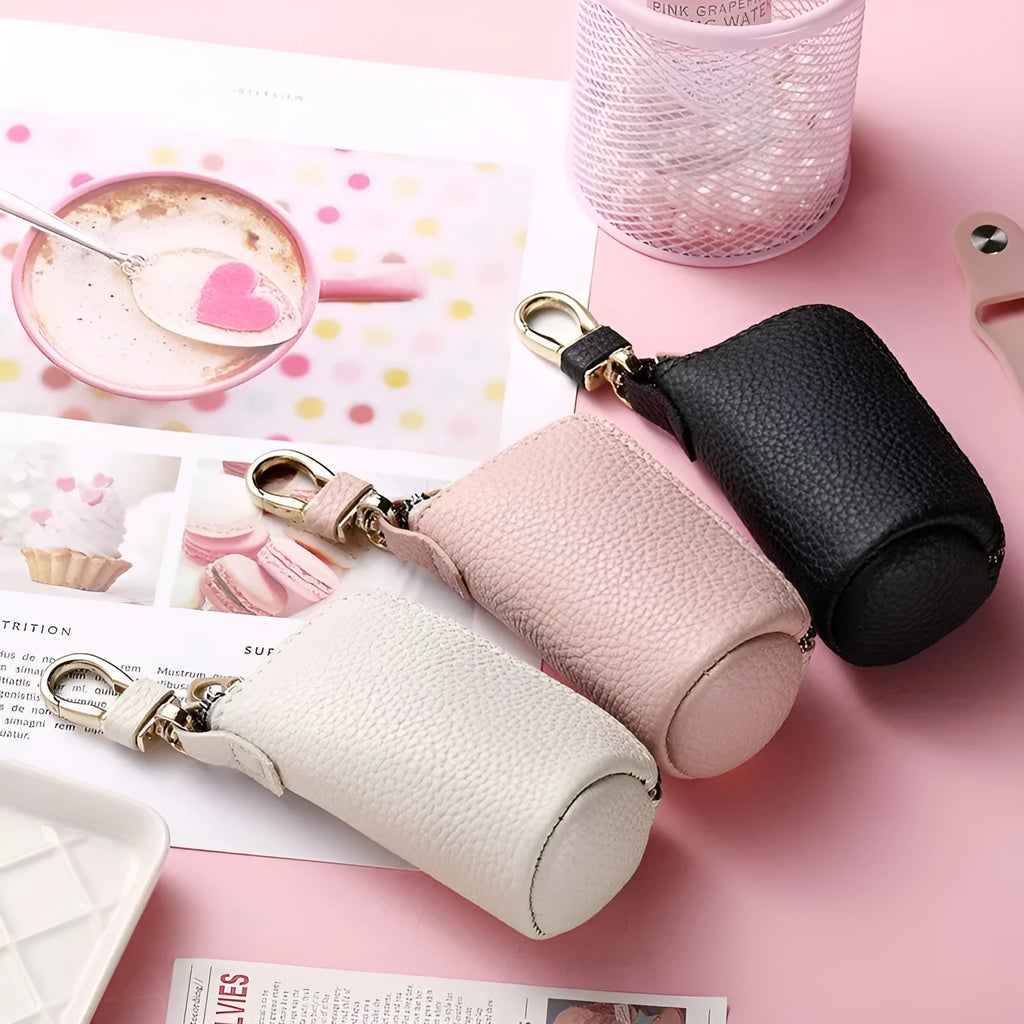 Minimalist waterproof PU leather key case with zipper closure in black, grey, and pink colours