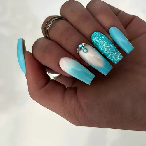 Smart blue diamond coloured press-on artificial nails in a ballet length style.