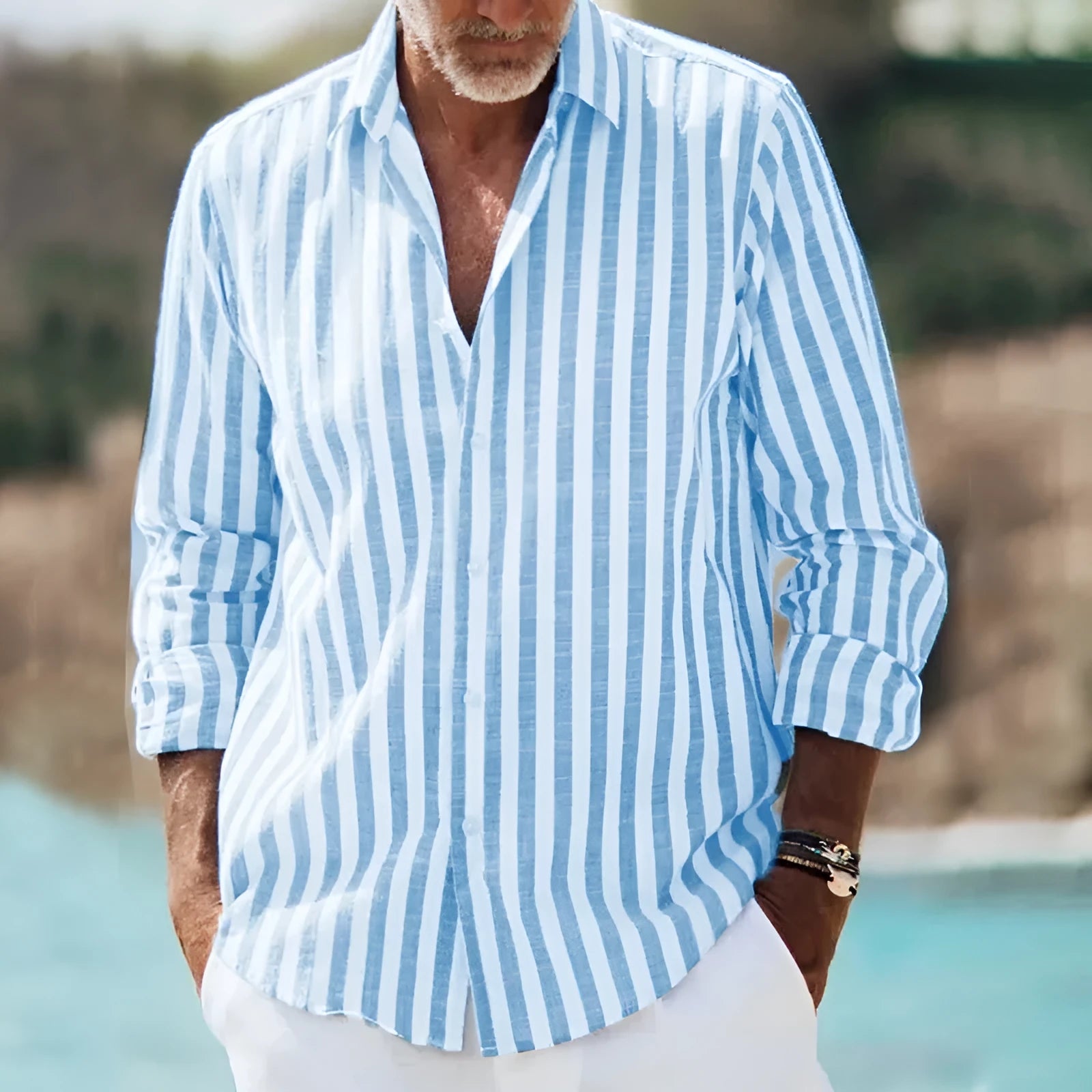 Man wearing a loose blue plaid shirt with 3D floral print and a lapel collar.