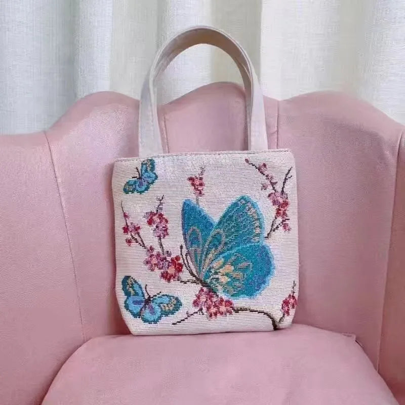 Double-sided gold wire embroidered handheld canvas tote bag in a choice of seven patterns and three sizes.