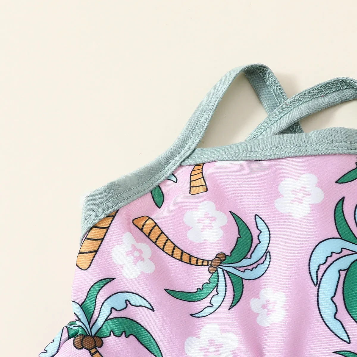 White children's sweet style swimsuit set with shirt and shorts on a hanger.