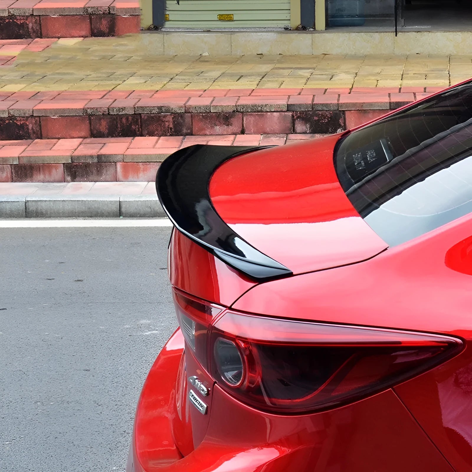Large bright black sports tail blade trim for Mazda 3 Axela Exela rear bumper.