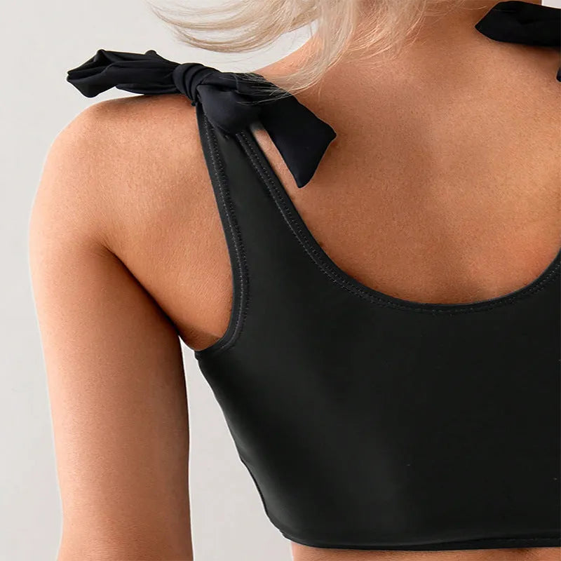Women's coconut print bikini with lace-up front on bikini top.