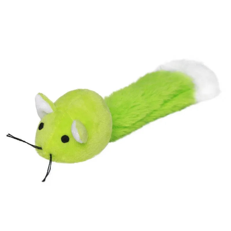 Three plush toy mice in green, pink, and blue with long tails, arranged on a surface