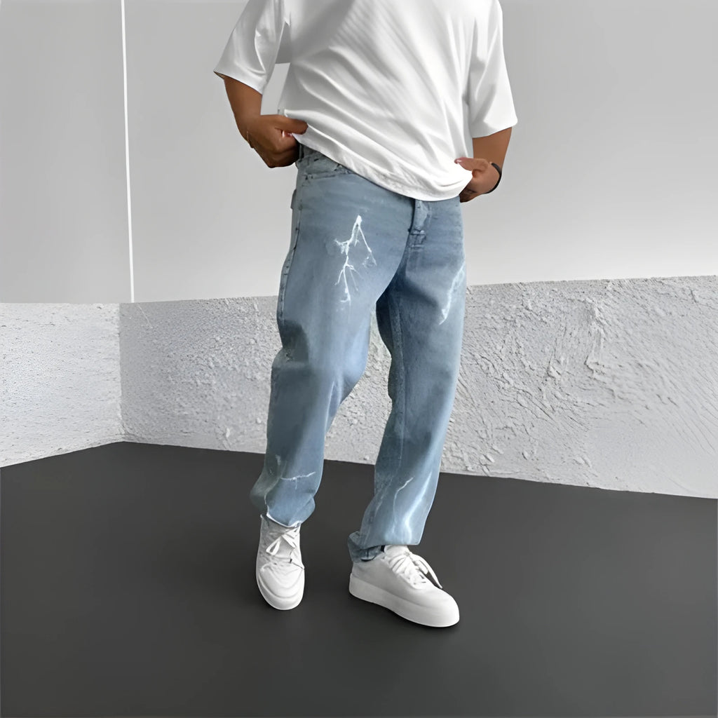 Men's blue straight-leg denim jeans with mid waist and zipper fly on solid background
