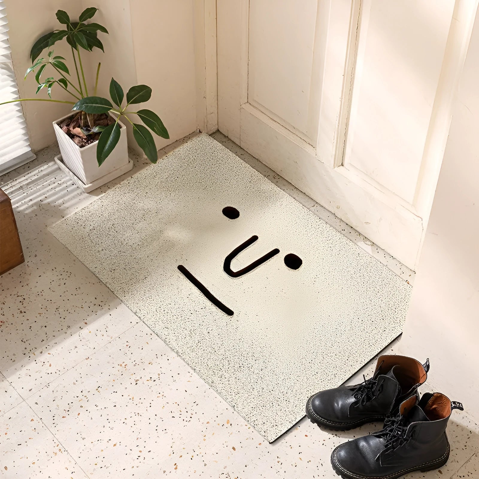Square PVC floor mat with cartoon facial expression and geometric pattern in Mr Big Nose colour