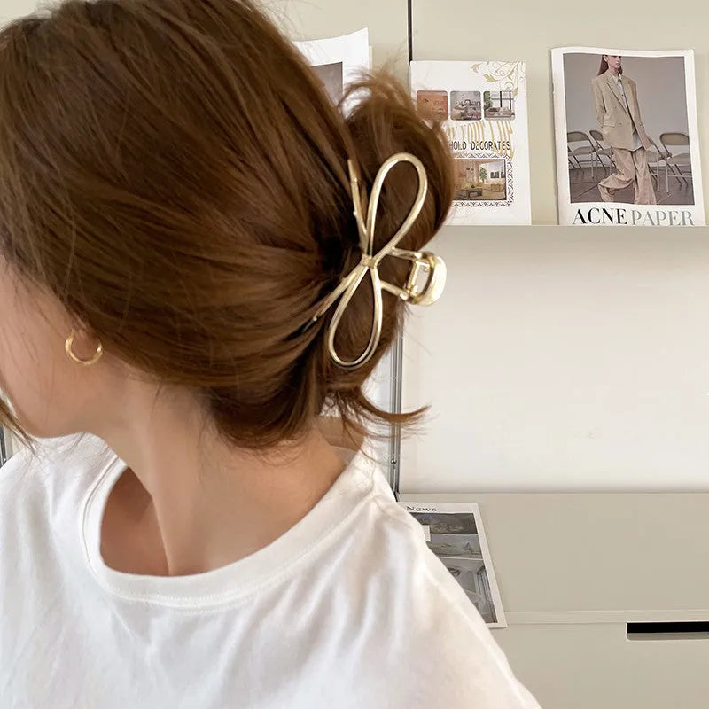 Women's alloy bow barrette hair clip in gold or silver with back-head grip