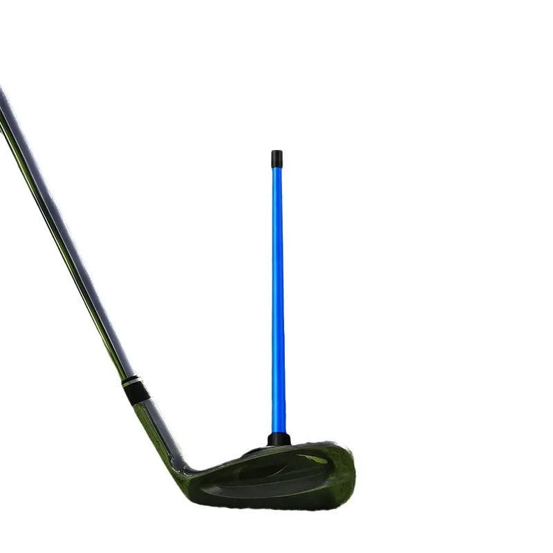 Red aluminium alloy magnetic golf alignment trainer bar on a putting green.
