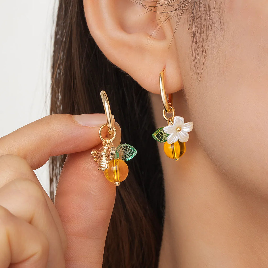 Women's sweet ear cuffs in XY-123 with bee, glass, leaf, and flower pendant details, supplied as one pair.
