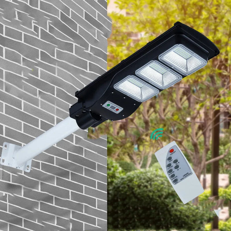 Integrated solar street light unit with solar panel and LED light source for outdoor installation