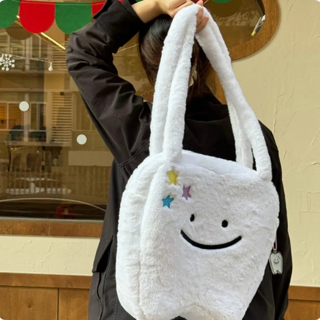 White crossbody shoulder bag with plush large tooth pattern and zipper closure
