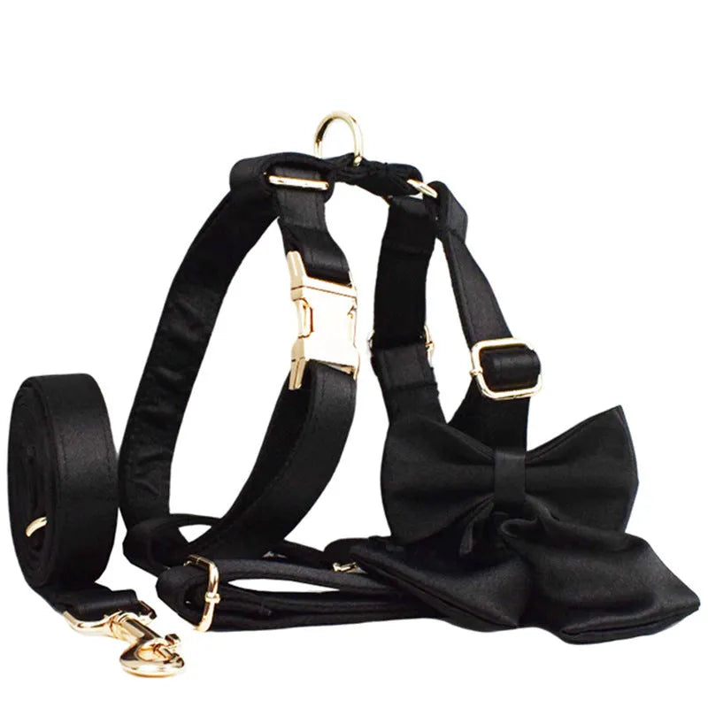 Dog harness and leash set with adjustable chest strap, matching bow, and vest accessories in fabric construction