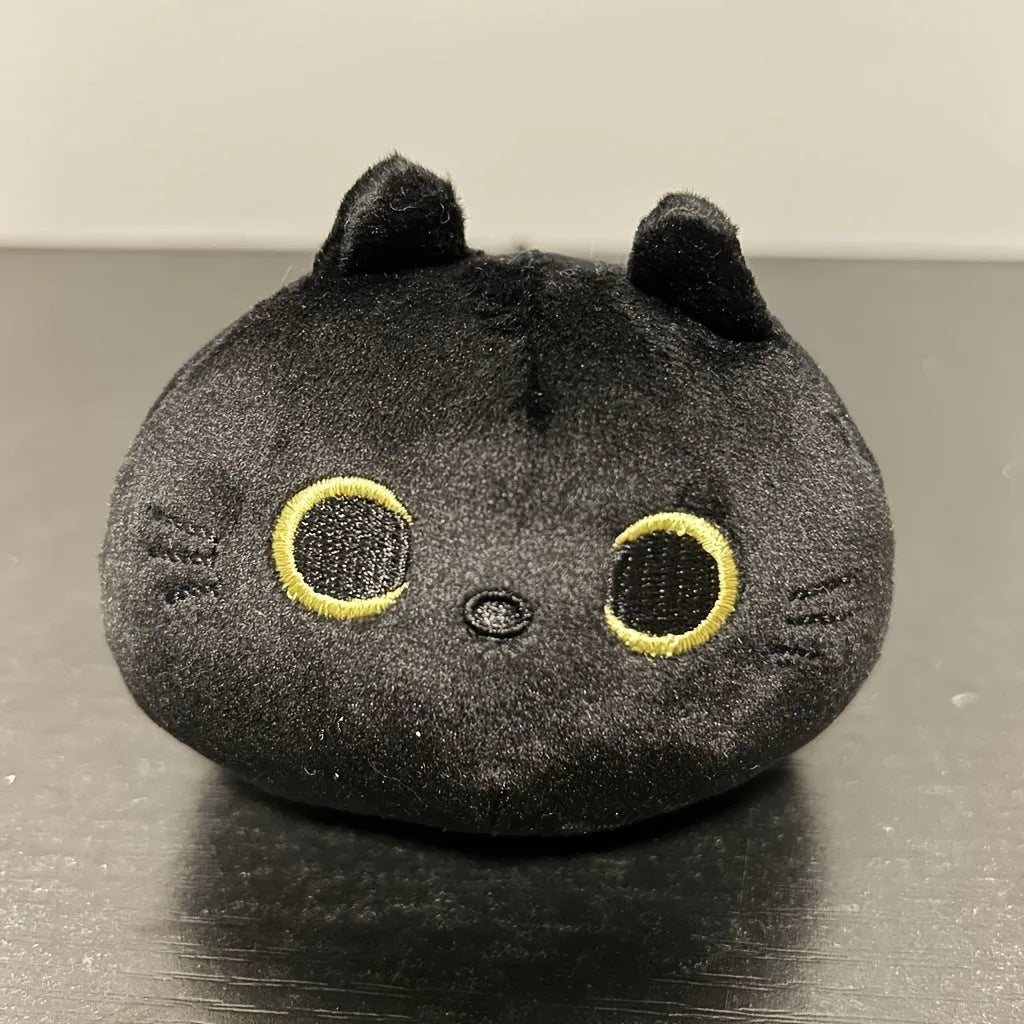 Black fluffy cat plush toy stuffed animal shown as a soft pillow cushion approximately 35cm long.