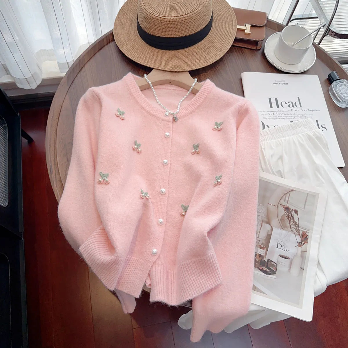 Women's slim fit cashmere blend cardigan coat with beaded details in blue, pink, red, and white.