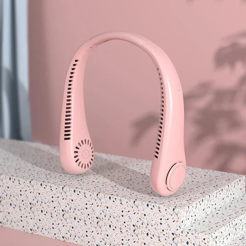 White bladeless neck fan hanging around neck with USB charging cable