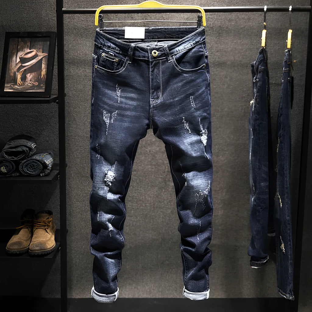 Men's slim-fit skinny jeans in dark blue denim on a neutral background.