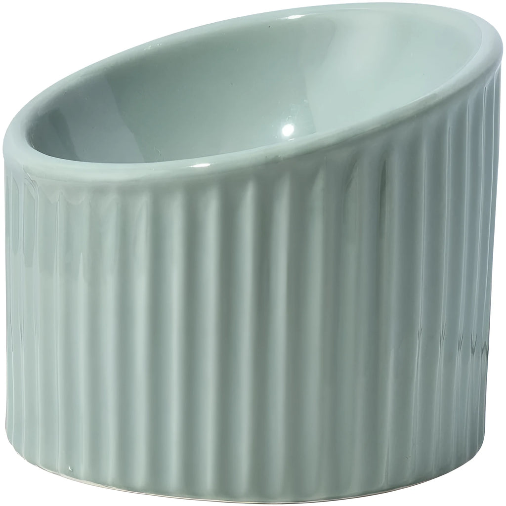 Ceramic elevated cat bowl in green with tilted round shape and raised feeding height