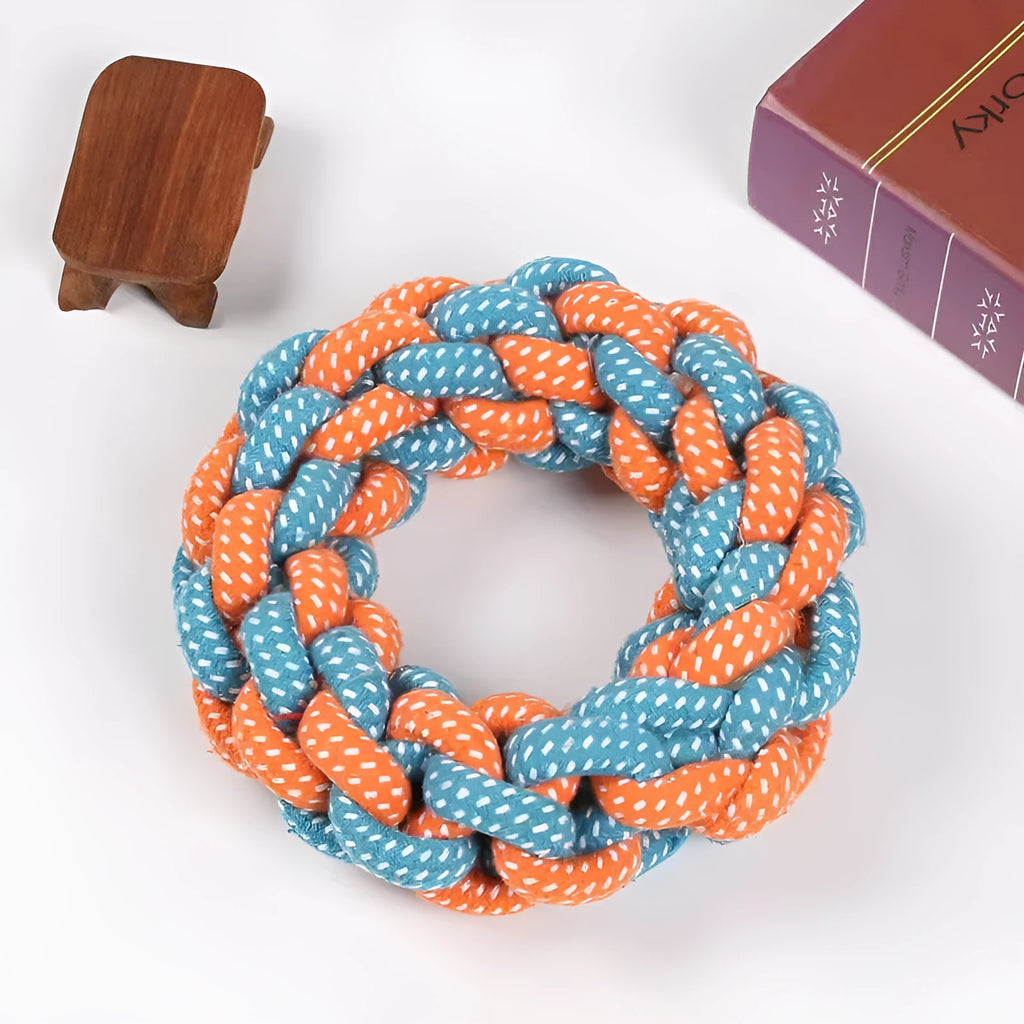 Close-up of a cotton braided ring knot toy for dogs, approximately 18cm diameter, made from cotton thread in a random colour