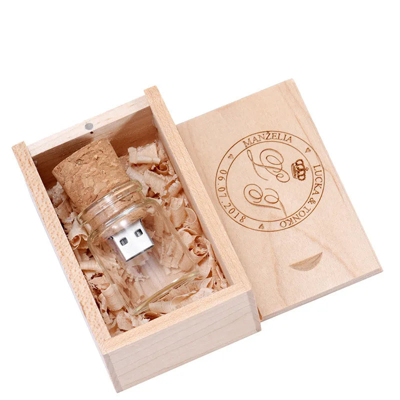 Chocolate brown wooden drift bottle shaped USB flash drive on a wooden surface.
