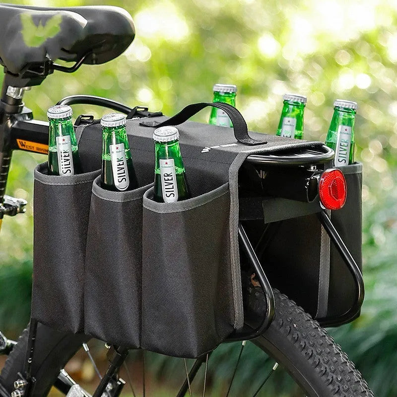 Black and orange double-sided bicycle drink storage bag mounted on a bike rack.