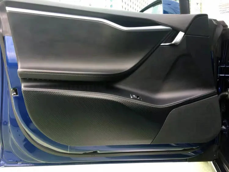 Four-piece clear protective film kit for Tesla Model S car door control panels.