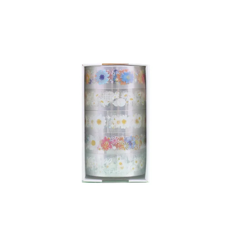 Five rolls of transparent decorative adhesive tape with Midsummer Daisy pattern, showing 1.5cm width