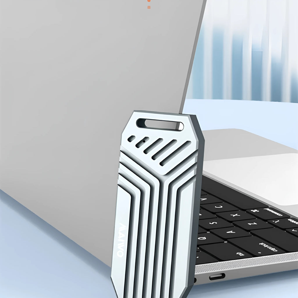 Silver and grey aluminium Thunderbolt 4 external SSD enclosure for M.2 drives, shown next to a cooling fan accessory.