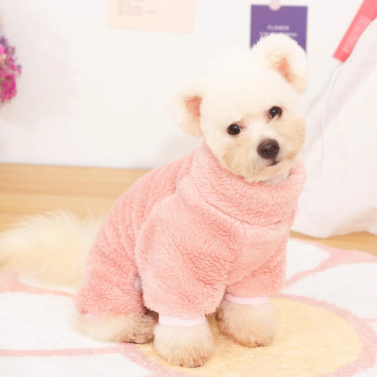 Khaki four-legged dog coat with high collar and plush fleece, shown with a towing ring on the back.