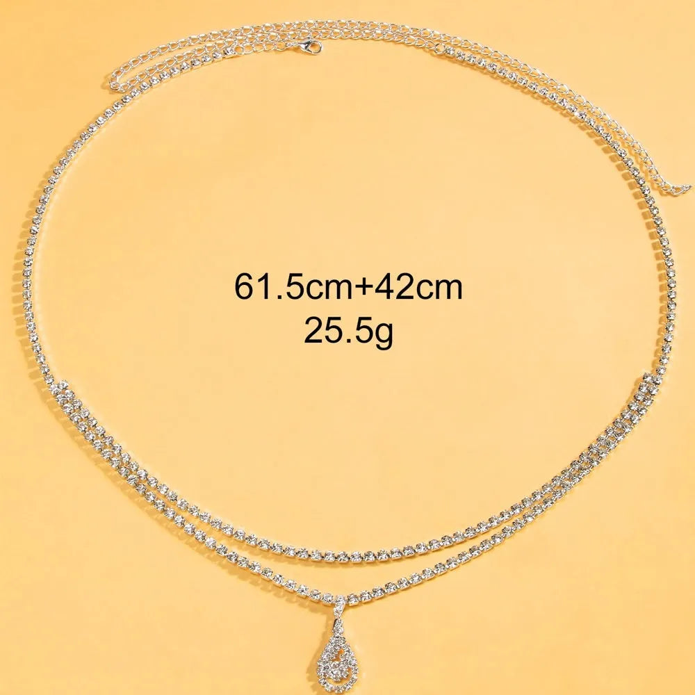 Gold or silver women's waist chain with water drop pendant and rhinestone tassel, showing lobster clasp.