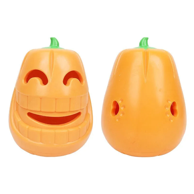 Red and orange Halloween pumpkin shaped interactive dog chew toy on a white background.