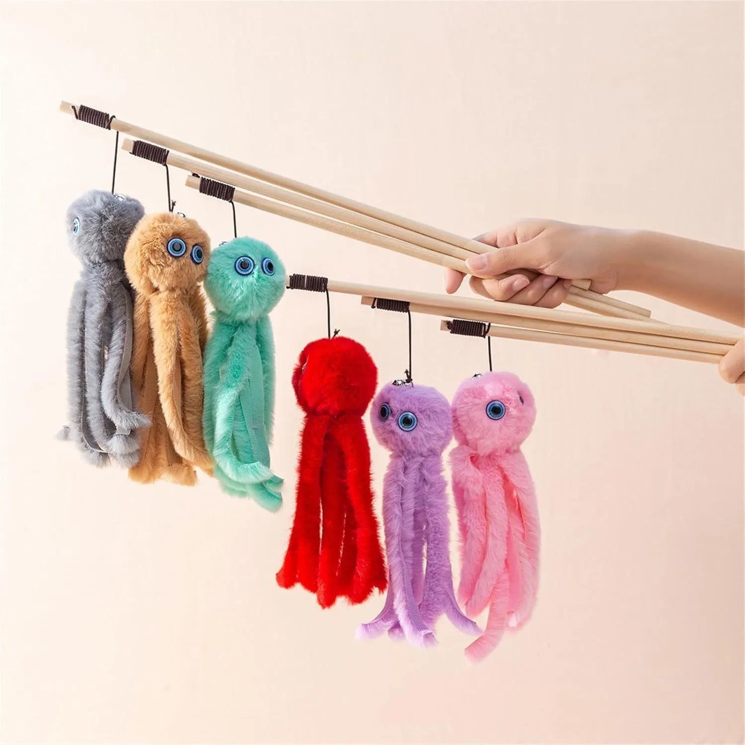 Colourful octopus cat toy with eyes on a long stick for interactive indoor play with kittens and cats