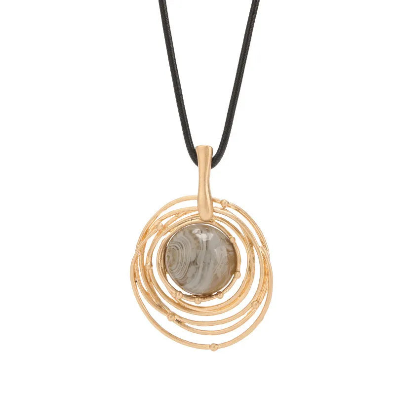 Gold geometric sweater chain necklace with adjustable snakeskin rope chain and large round pendant