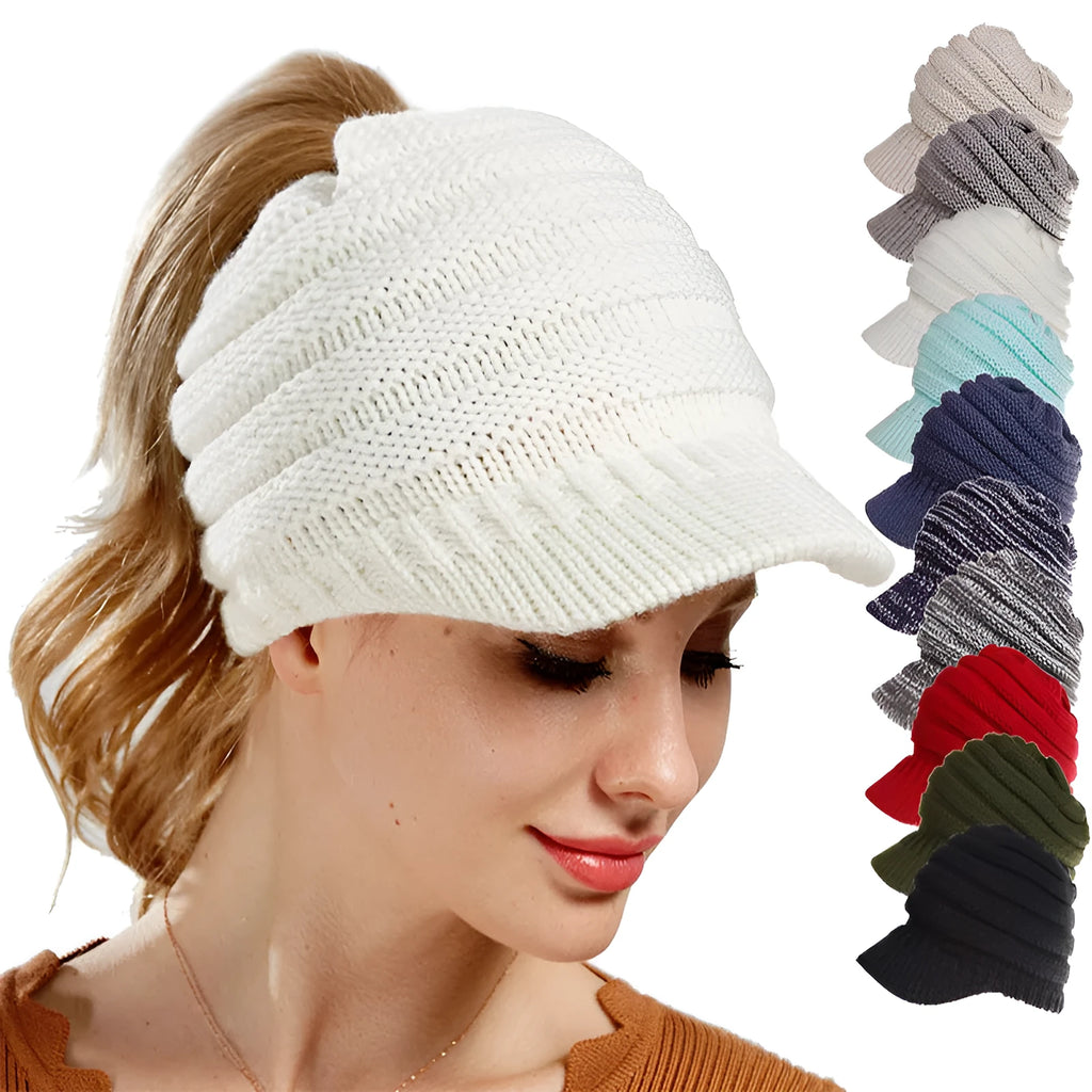 Woman wearing a thick knitted beanie with her ponytail pulled through the hole in the crown.