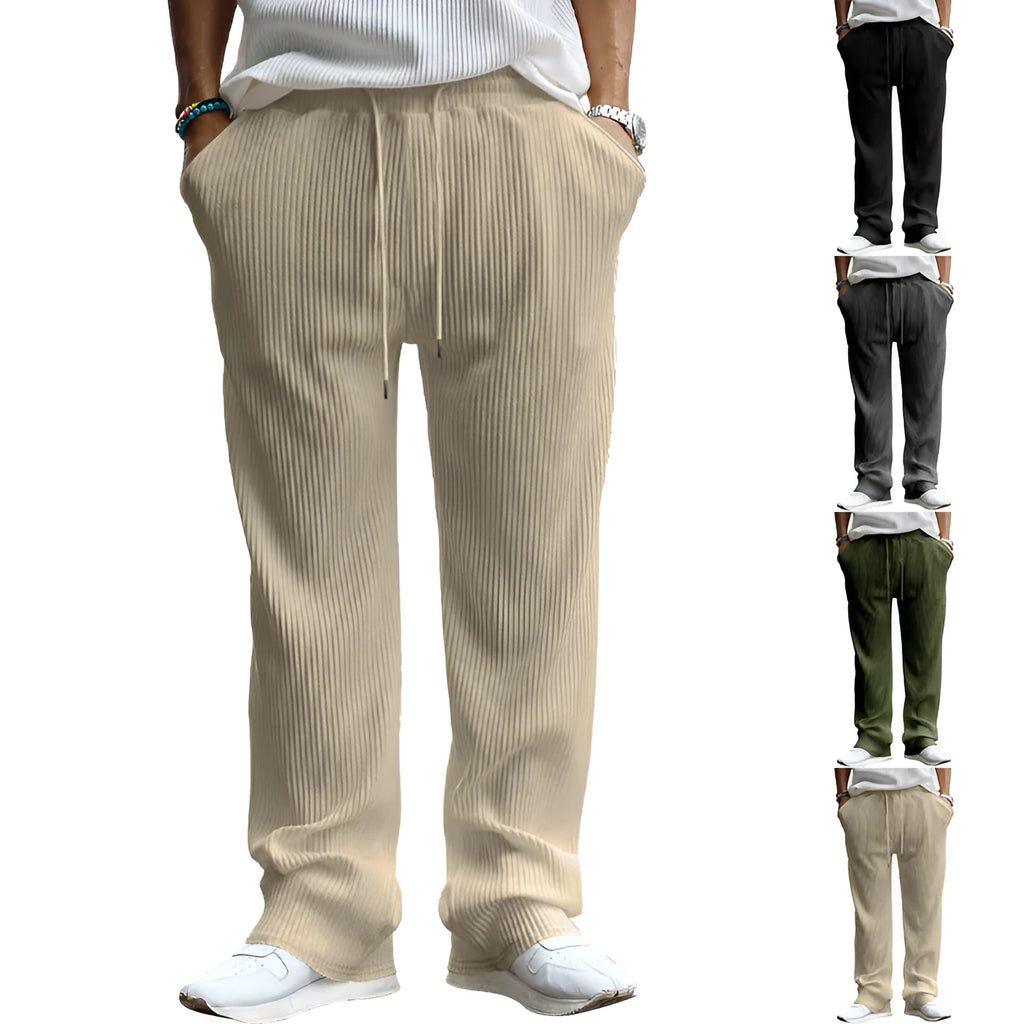 Man wearing loose-fit high-waisted straight leg casual trousers in Army Green.