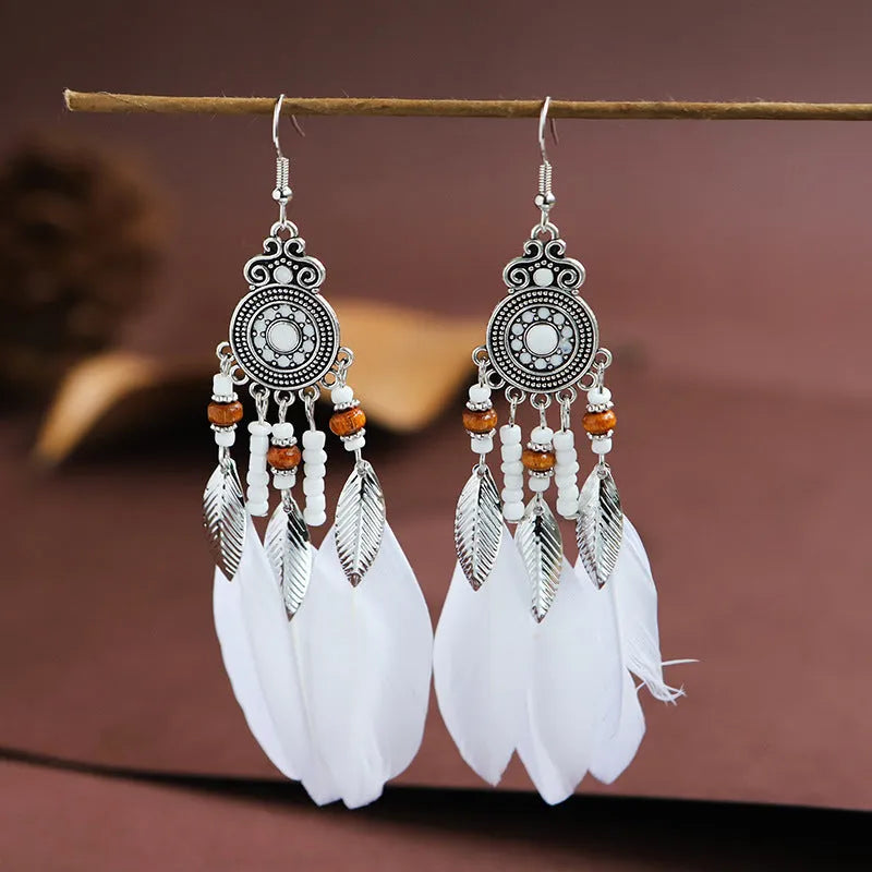 Round drop feather earrings with leaf pattern in alloy metal, available in multiple colours