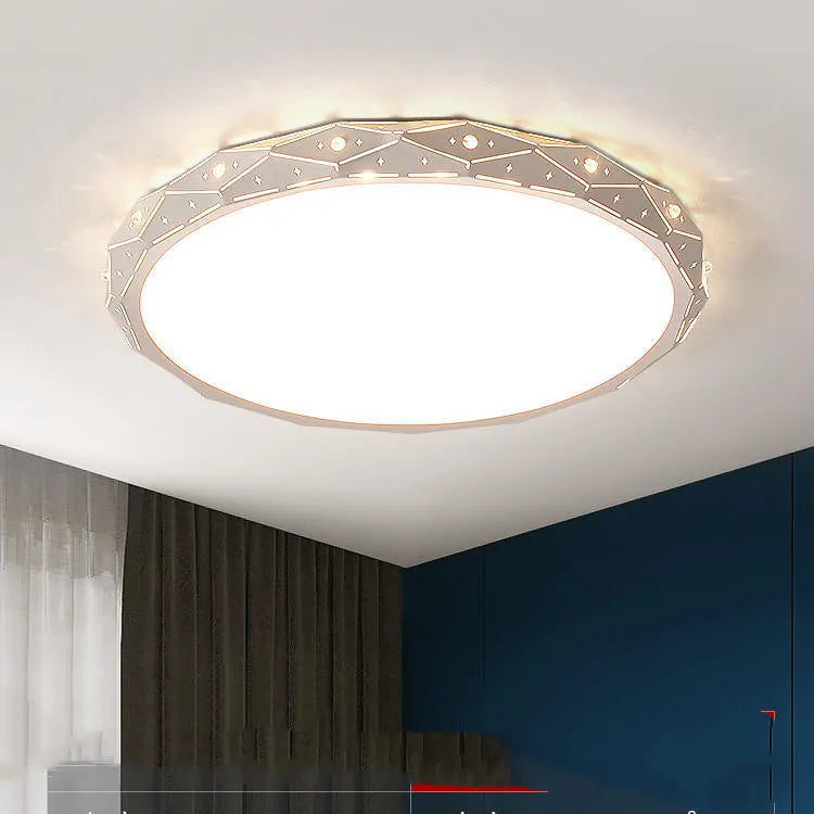 Round black iron frame LED ceiling light on a white ceiling.