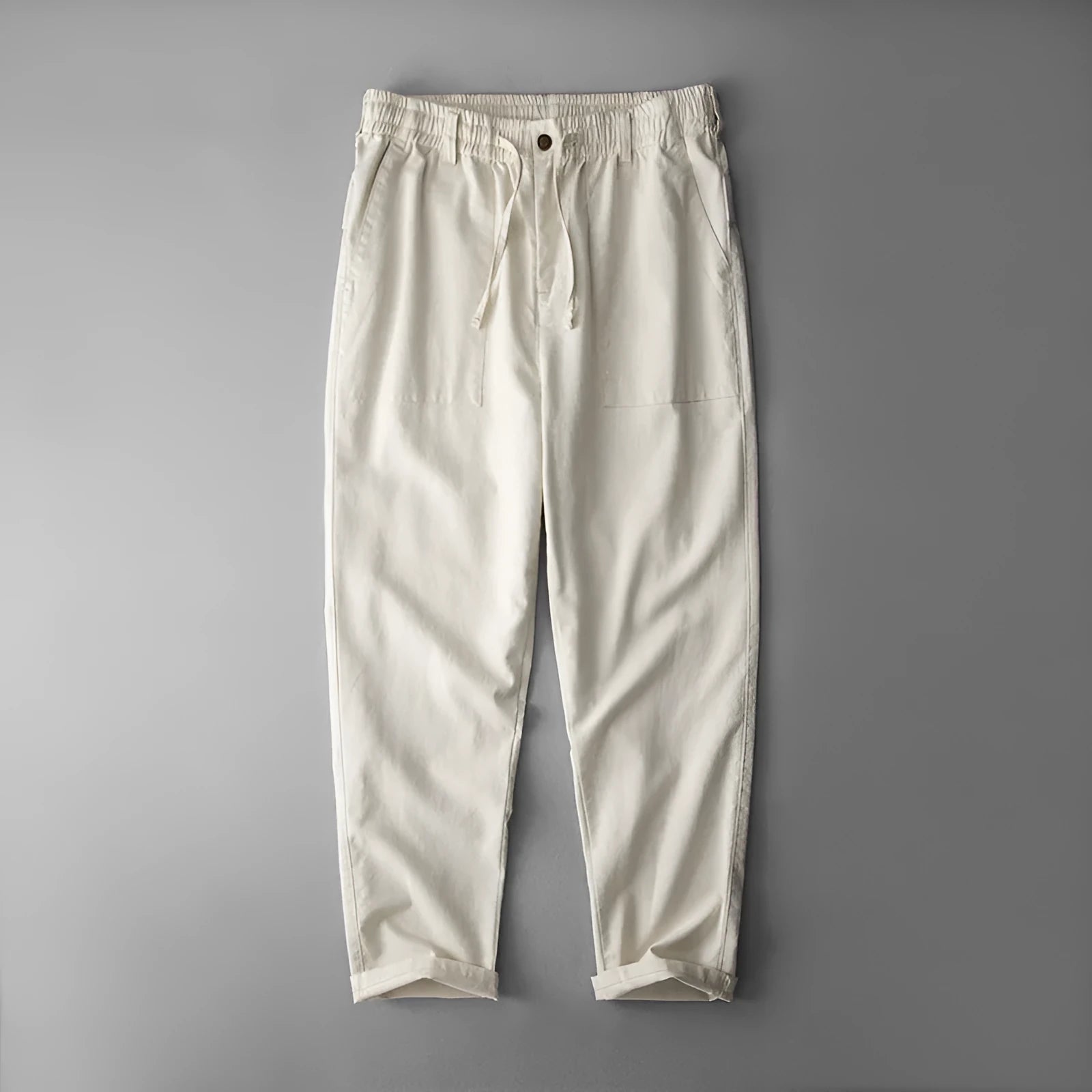 Men's solid colour linen casual trousers in mid-waist fit shown in grey, navy, or apricot.