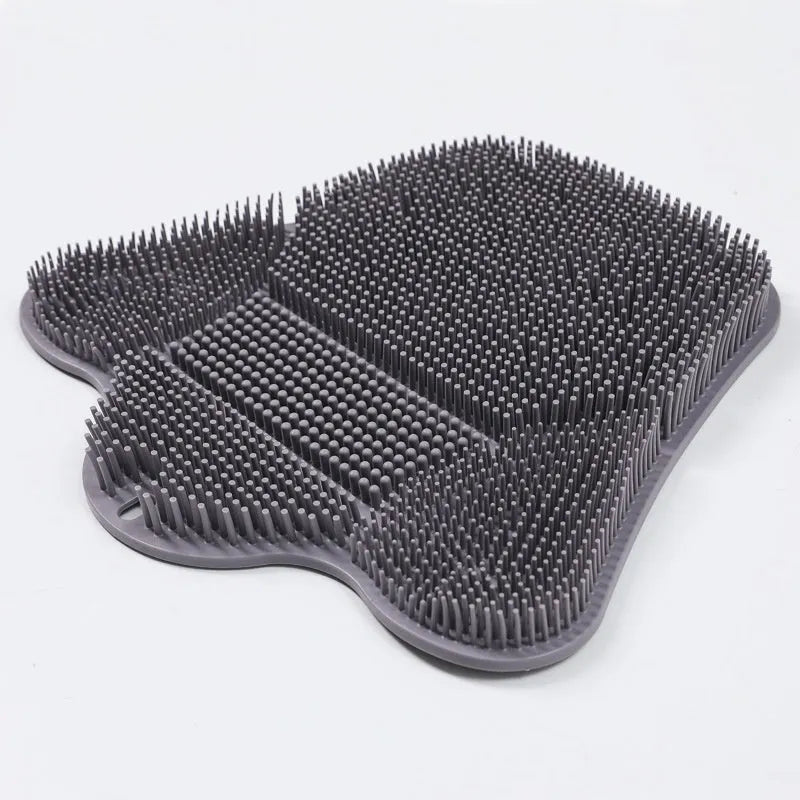 Blue silicone bath scrub mat for back washing, measuring 31cm by 32cm, mounted on a shower wall.