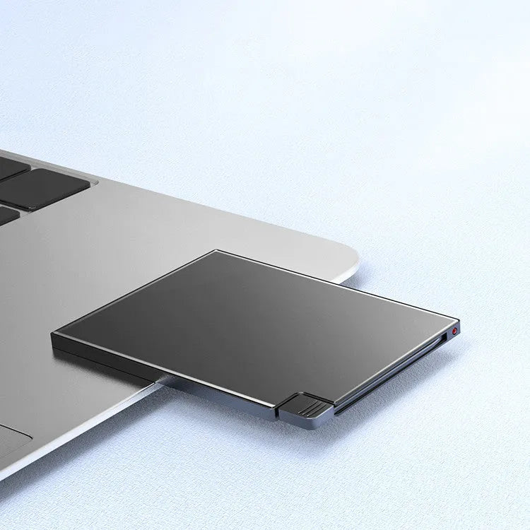 Ultra-thin black alloy card type power bank with built-in charging cable 10000mAh placed on a desk