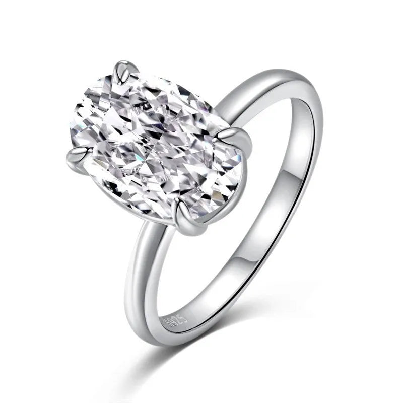 Gold or silver oval women's ring with a four-claw setting holding a hand-cut stone.